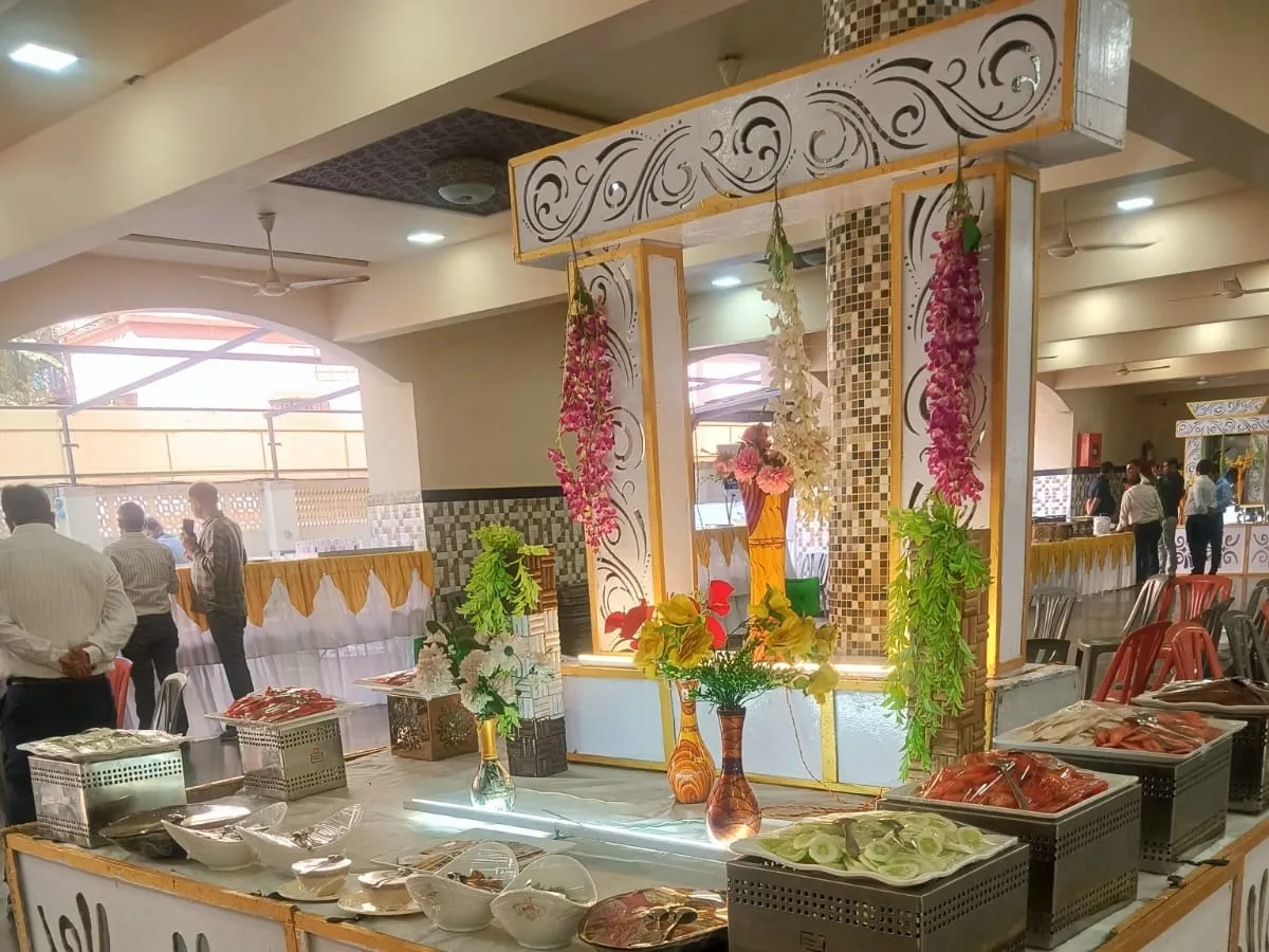 Buffet counter decorated with flowers at a function hall