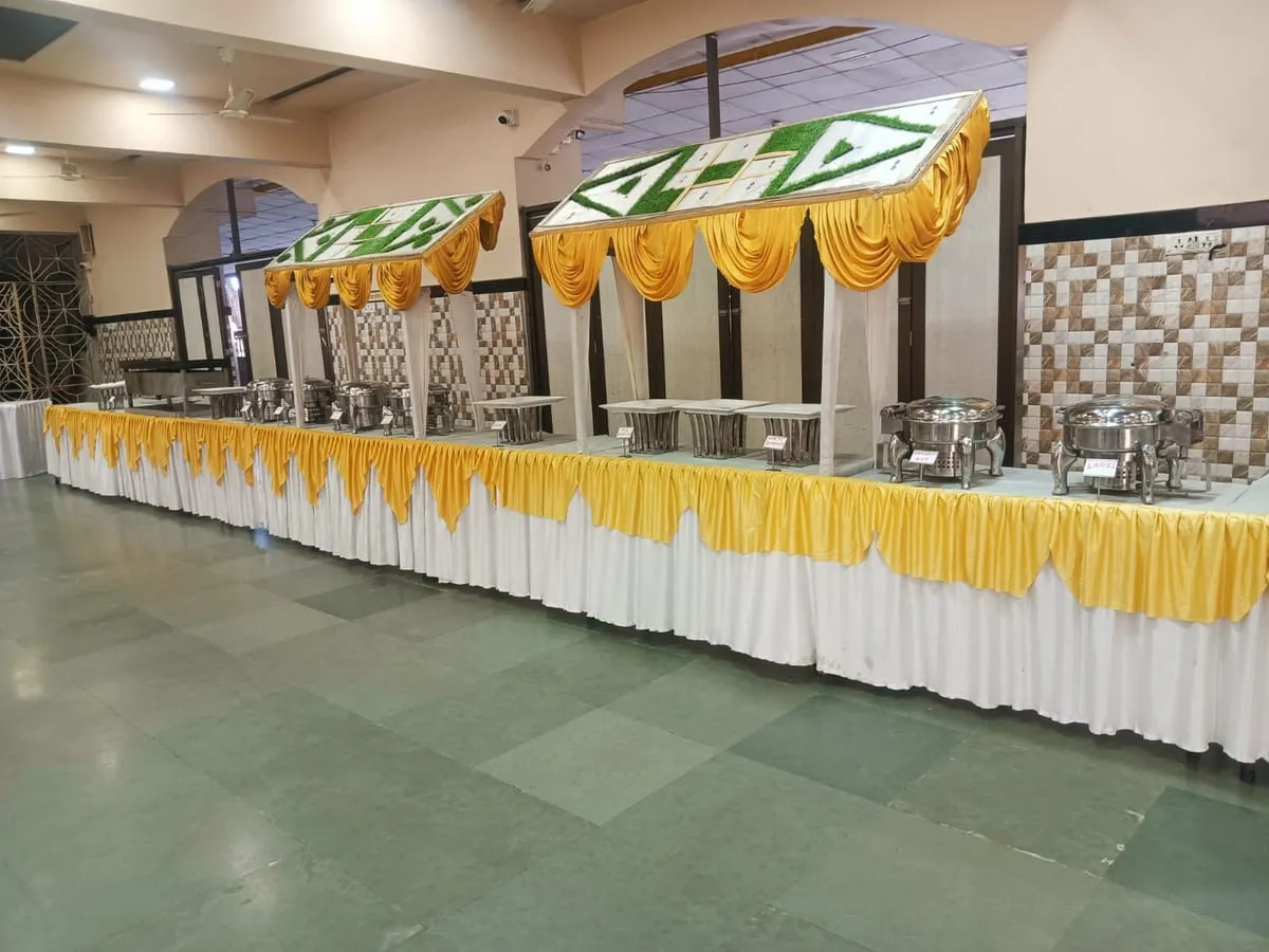 Buffet line with a green valance in a function hall
