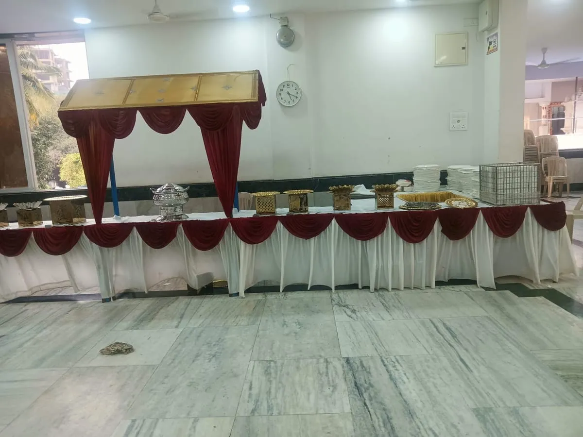 Buffet line set up with a decorated canopy