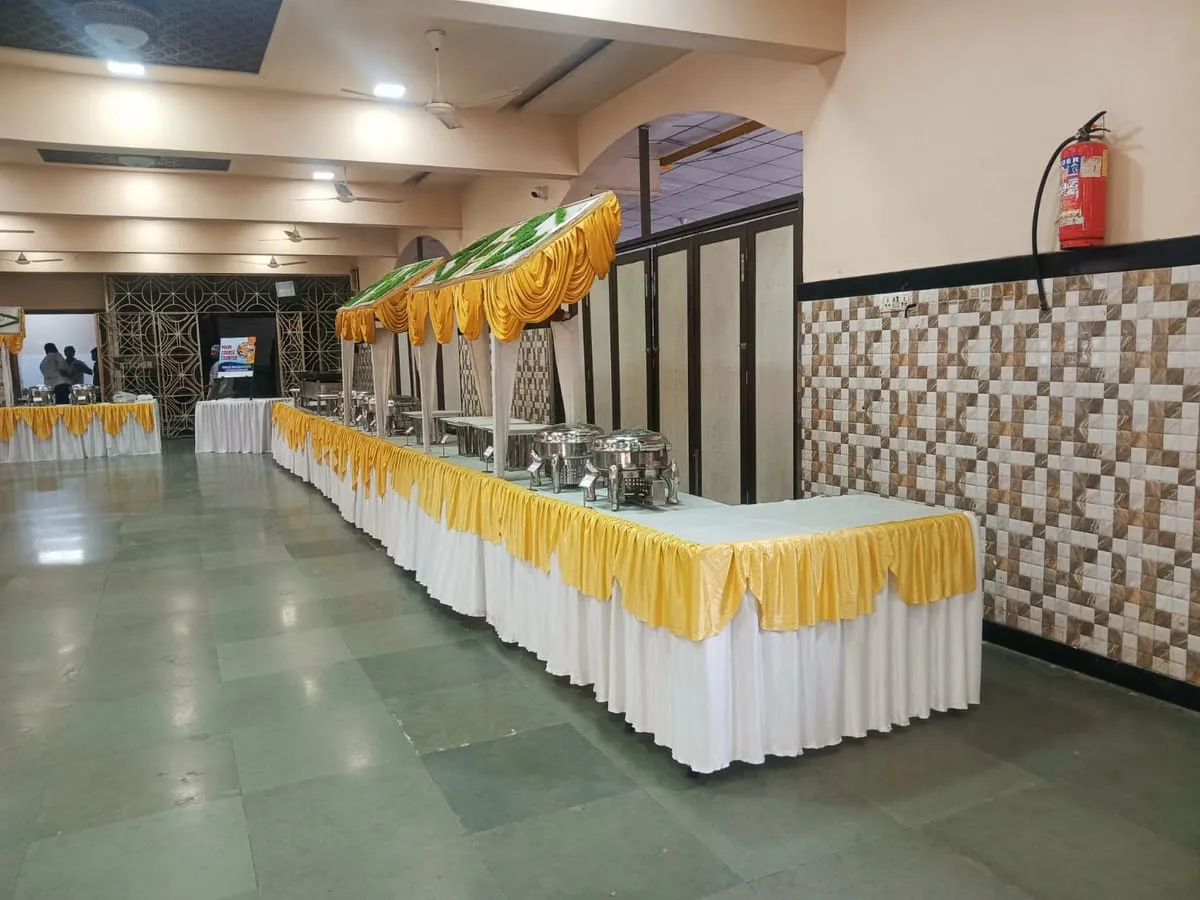 Buffet line with yellow and white skirting