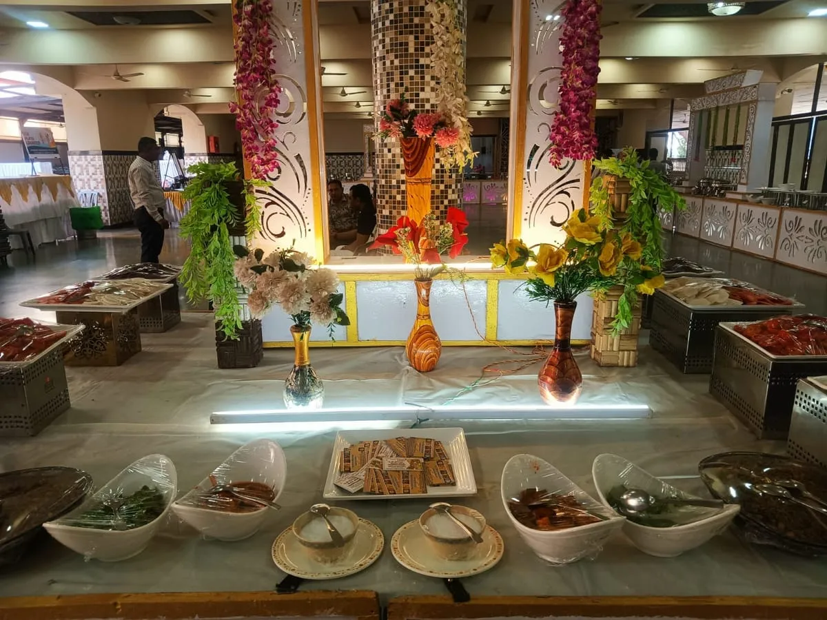 Buffet spread with floral decoration in a function hall