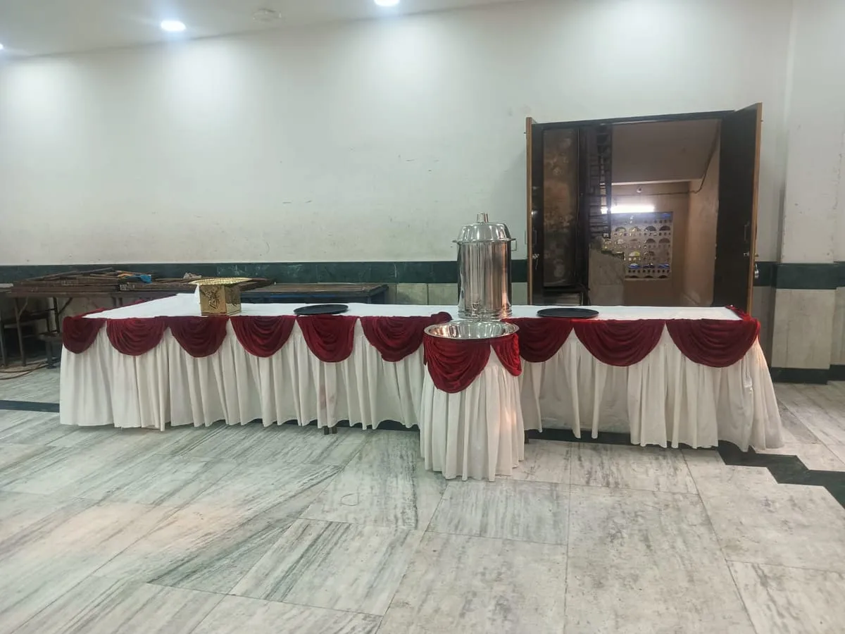 Buffet table with maroon and white skirting