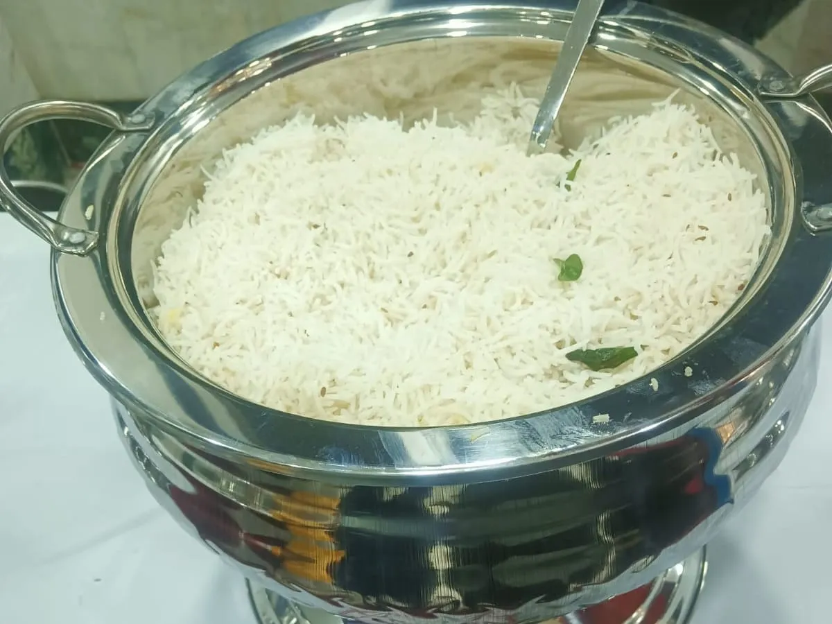 Jeera rice in a labelled chafing dish