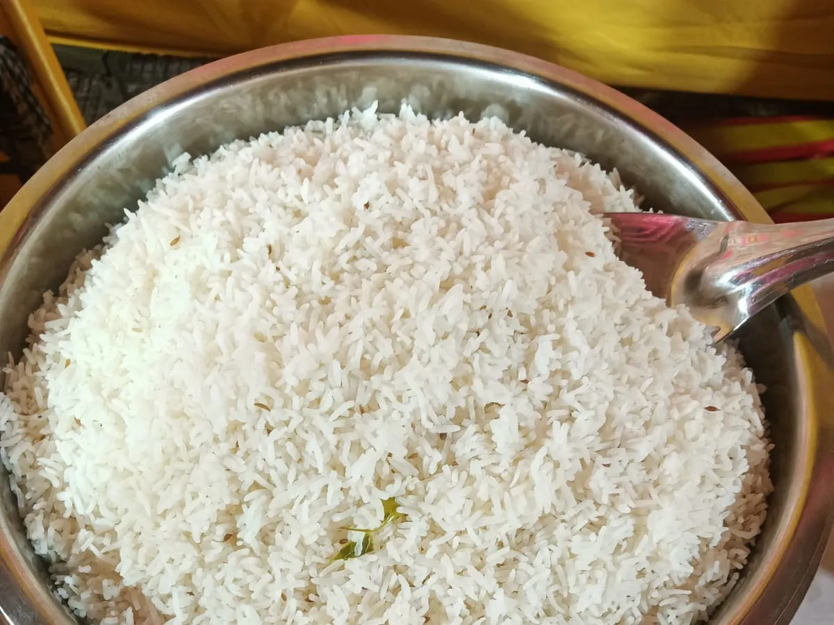 Steamed rice served in a copper bowl